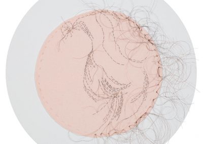 Ancestry of Anger detail of Betty Freidan, 2016, hand-sewn human hair on fabric, each 8” diameter
